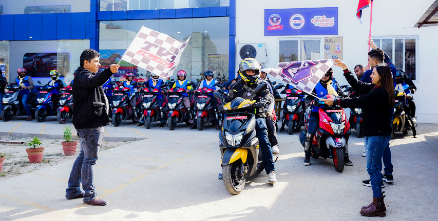 AOG group image during tour with TVS motorcycle